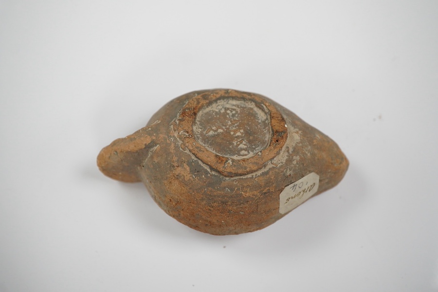 An Ancient Greek 'Athens' terracotta oil lamp, 10cm. Condition - fair